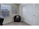 Bedroom features a comfortable accent chair, a window view, and a closet with sliding doors at 1246 Blackhaw St, Elizabeth, CO 80107
