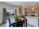 Dining area with access to backyard, natural light and view to the modern kitchen at 1246 Blackhaw St, Elizabeth, CO 80107