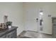 Bright foyer with a white front door, stylish decor, and wood-look flooring, creating a welcoming entrance at 1246 Blackhaw St, Elizabeth, CO 80107