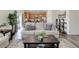 Spacious living room with a view into the kitchen, featuring comfortable seating and modern furnishings at 1246 Blackhaw St, Elizabeth, CO 80107