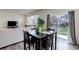 Bright living room and dining area with a sliding glass door that offers views of the backyard at 1246 Blackhaw St, Elizabeth, CO 80107