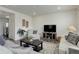 Comfortable living room with neutral furniture, a TV, and stylish decor, creating a relaxing atmosphere at 1246 Blackhaw St, Elizabeth, CO 80107
