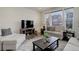 Cozy living room featuring comfortable seating, a TV, and natural light, perfect for relaxing and entertaining at 1246 Blackhaw St, Elizabeth, CO 80107
