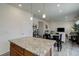 Open-concept living room and kitchen area with a dining table and chairs at 1246 Blackhaw St, Elizabeth, CO 80107
