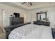 An open primary bedroom features a rustic gray dresser for extra storage space at 1246 Blackhaw St, Elizabeth, CO 80107