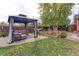 Gazebo and patio furniture in backyard at 103 S Park Ave, Fort Lupton, CO 80621