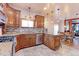 Spacious kitchen with ample counter space and wood cabinetry at 103 S Park Ave, Fort Lupton, CO 80621