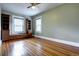 Well-lit bedroom featuring hardwood floors and built-in bookcases at 471 N Humboldt St, Denver, CO 80218