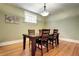 Dining room featuring hardwood floors, chandelier, and wainscoting at 471 N Humboldt St, Denver, CO 80218