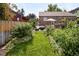 Backyard with green grass and an outdoor seating area, perfect for entertaining or relaxing at 4419 W 34Th Ave, Denver, CO 80212