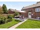 Charming backyard patio with cozy seating and lush greenery, perfect for outdoor entertaining at 4419 W 34Th Ave, Denver, CO 80212