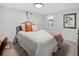 Cozy basement bedroom with white walls, large bed, and unique decorative accents create a relaxing retreat at 4419 W 34Th Ave, Denver, CO 80212