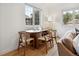 Dining area with modern wood table set and hardwood floors at 4419 W 34Th Ave, Denver, CO 80212