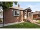 A charming brick home with a well-manicured lawn and inviting entrance at 4419 W 34Th Ave, Denver, CO 80212