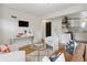 Open-concept living room leading to a modern kitchen, showcasing a comfortable and stylish design at 4419 W 34Th Ave, Denver, CO 80212