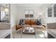 Cozy living room with a leather sofa and glass-topped coffee table at 4419 W 34Th Ave, Denver, CO 80212