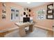 Cozy home office with natural light, light pink walls, and decorative wall hangings at 4419 W 34Th Ave, Denver, CO 80212