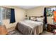 Cozy bedroom with a double bed and neutral decor at 4400 S Quebec St # 204N, Denver, CO 80237