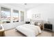 Inviting bedroom with lots of natural light, neutral decor, and modern lighting at 2851 W 52Nd Ave # 304, Denver, CO 80221