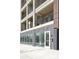 Exterior of a modern building entrance with large glass windows at 2851 W 52Nd Ave # 304, Denver, CO 80221