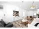 Open-concept living space with modern furniture, sleek console, and stylish decor at 2851 W 52Nd Ave # 304, Denver, CO 80221
