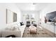 Bright living room features a modern aesthetic, stylish decor, and plenty of natural light at 2851 W 52Nd Ave # 304, Denver, CO 80221