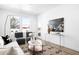 Bright living room features modern furniture, stylish decor, and plenty of natural light at 2851 W 52Nd Ave # 304, Denver, CO 80221