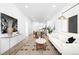 Spacious living room with a large rug, contemporary decor, and lots of natural light throughout the home at 2851 W 52Nd Ave # 304, Denver, CO 80221