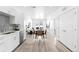 Open-concept living space features a stylish kitchen, dining area, and comfortable seating at 2851 W 52Nd Ave # 304, Denver, CO 80221