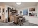 Basement bar with rustic wood cabinetry and counter offers ample space for entertaining at 4526 N Quatar Ct, Aurora, CO 80019