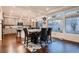 Bright dining area with a table, chairs, and a view of the kitchen and outdoor area at 4526 N Quatar Ct, Aurora, CO 80019