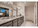 Bathroom featuring double vanity, granite countertops, and tile flooring at 4526 N Quatar Ct, Aurora, CO 80019