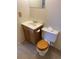 Simple bathroom with wood vanity and toilet at 9573 E Kansas Cir # 57, Denver, CO 80247