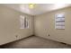 Well-lit bedroom featuring neutral walls and carpet at 9573 E Kansas Cir # 57, Denver, CO 80247