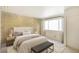 Spacious bedroom with large window and accent wall at 9573 E Kansas Cir # 57, Denver, CO 80247