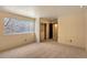 Bright bedroom with window, closet, and neutral walls at 9573 E Kansas Cir # 57, Denver, CO 80247