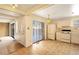 Bright kitchen features white cabinetry, tile floors, and sliding glass door to patio at 9573 E Kansas Cir # 57, Denver, CO 80247