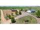 Expansive property with horse area, charming red barn, lush pasture, and stunning countryside views at 10691 County Road 23, Fort Lupton, CO 80621