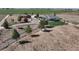 Beautiful aerial view of the house, surrounded by lush green fields and an ample driveway at 10691 County Road 23, Fort Lupton, CO 80621