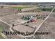 Expansive property with a home, red barn, outbuildings and horse riding area with farm fields surrounding at 10691 County Road 23, Fort Lupton, CO 80621