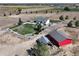 Aerial view showing a house, barn, and spacious yard at 10691 County Road 23, Fort Lupton, CO 80621