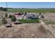 Scenic aerial view of the house and barn, surrounded by lush green fields and picturesque landscapes at 10691 County Road 23, Fort Lupton, CO 80621