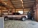 Barn interior with a truck and various items at 10691 County Road 23, Fort Lupton, CO 80621