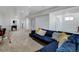 Large finished basement with seating and entertainment space, perfect for gatherings at 10691 County Road 23, Fort Lupton, CO 80621