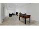 Spacious finished basement offers a recreational area with a foosball table and comfortable seating at 10691 County Road 23, Fort Lupton, CO 80621