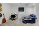 Comfortable bedroom with desk, decorated with an acoustic guitar, perfect for studying at 10691 County Road 23, Fort Lupton, CO 80621