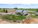 Charming home with a cozy front porch, mature landscaping, and fenced pasture land at 10691 County Road 23, Fort Lupton, CO 80621