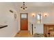 Welcoming foyer with a beautiful front door and modern lighting fixtures at 10691 County Road 23, Fort Lupton, CO 80621