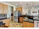 Well-equipped kitchen features stainless steel appliances, granite counters, and ample cabinet space for storage and meal prep at 10691 County Road 23, Fort Lupton, CO 80621