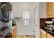 A conveniently located laundry room with modern washer and dryer units and additional counter space at 10691 County Road 23, Fort Lupton, CO 80621